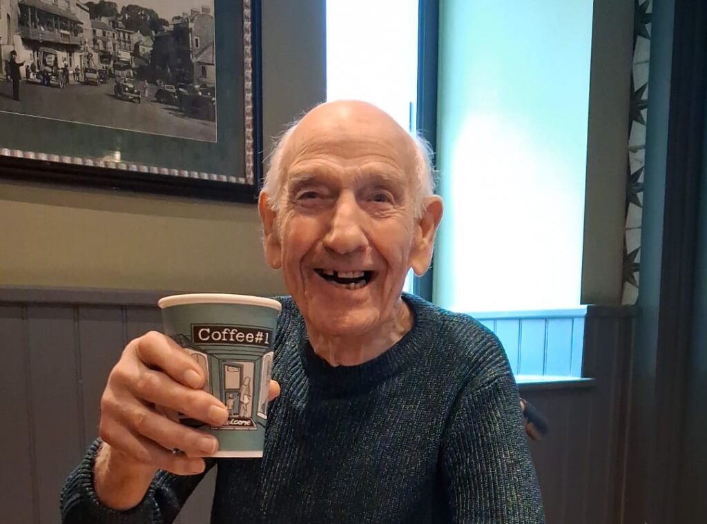 Collage of family members from a care home in Frome enjoying coffee, cake and pastries during a trip to a café in Frome town centre, showing everyday life and community connection at Catherine House in Frome, Somerset.